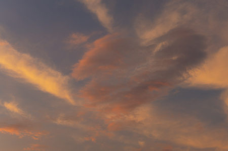 beautiful sky with a heart-shaped cloud and reflected sunlightの写真素材