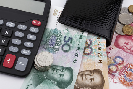 Chinese money (RMB),  a calculator and a black wallet. Business concept.の写真素材