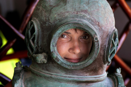 woman in an iron diving helmetの写真素材