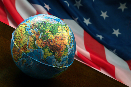 The globe on the background of the American flagの写真素材