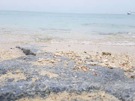 A rocky beach view from a island.の写真素材