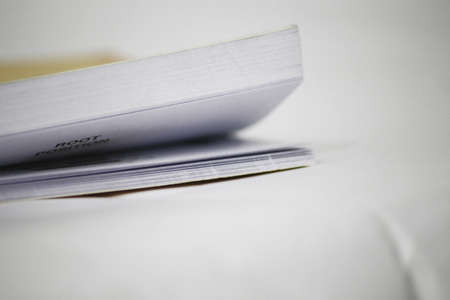 Flipping through the pages of a yellow book.の写真素材