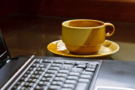 a cup of coffee with laptopの写真素材
