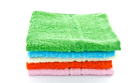 stacked colorful towels on a white backgroundの写真素材