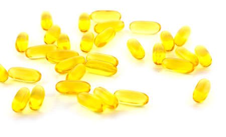Bright yellow capsulesの写真素材