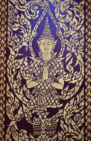 Ancient art pattern on the wooden door in Thai templeの写真素材