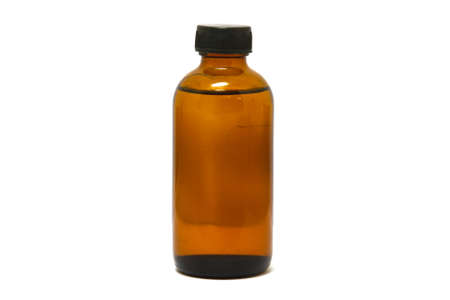Medicine bottle of brown glass isolated on white backgroundの写真素材