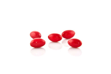 red pill on white isolatedの写真素材