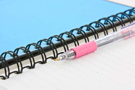 Notebook and pen on white isolatedの写真素材