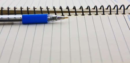 Notebook and pen on white isolatedの写真素材