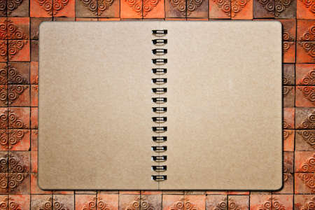 notebook on the brick background