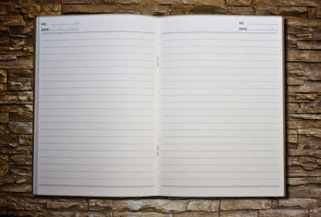 notebook on the brick backgroundの写真素材