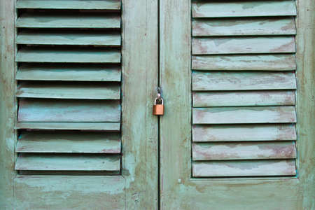 metal handle on a wooden doorの写真素材