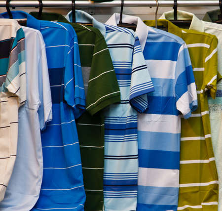 Colors of rainbow  Variety of casual shirts on wooden hangersの写真素材