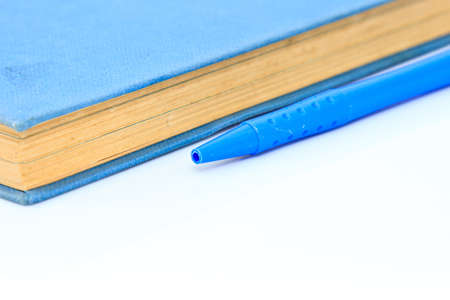 Notebook and pen on white isolated