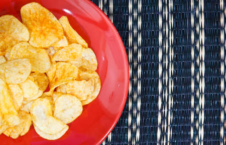 potato chips on wooden plate