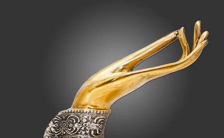 gold sculpture Buddha hand decoration in isolated with pathの写真素材