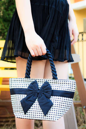 Portrait of happy young woman carrying shoulder bagの写真素材