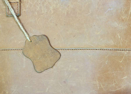brown leather label on a brown bagの写真素材