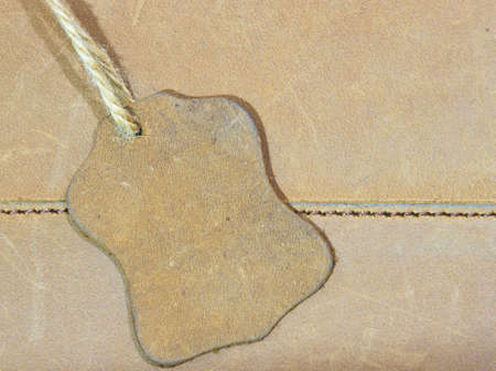 brown leather label on a brown bagの写真素材