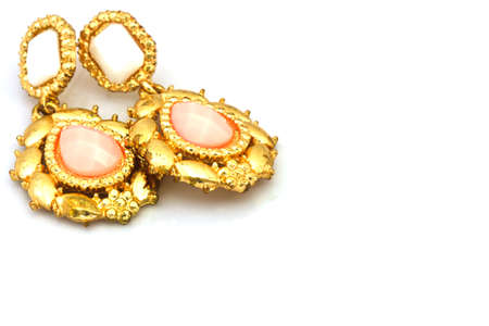 coral earrings isolated on white の写真素材