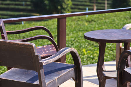 Empty wooden table with tea plantationの写真素材
