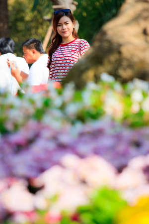 Young happy girl on the flower fieldの写真素材