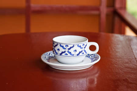 Cup of tea on wooden brown tableの写真素材