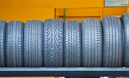 Group of new tires for sale at a tire storeの写真素材