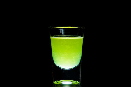 Delicious Smoothies of kiwi in glass isolated on a black backgroundの写真素材