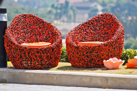 red chair in a gardenの写真素材