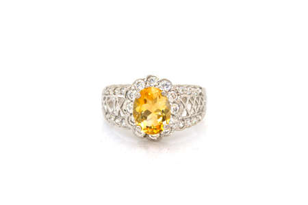 Yellow sapphire ring on whiteの写真素材