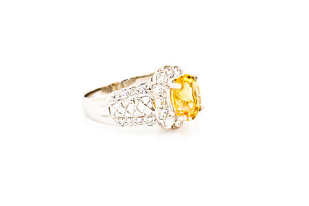 Yellow sapphire ring on whiteの写真素材