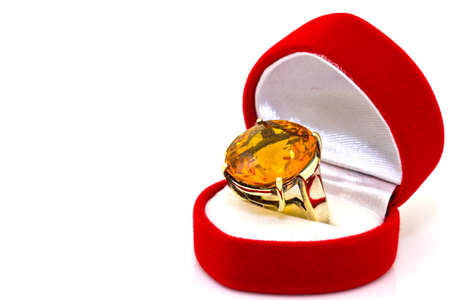 Yellow sapphire ring on whiteの写真素材