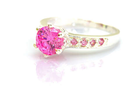 beautiful ring with pink gem isolated on whiteの写真素材