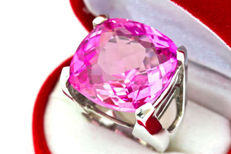 beautiful ring with pink gem isolated on whiteの写真素材