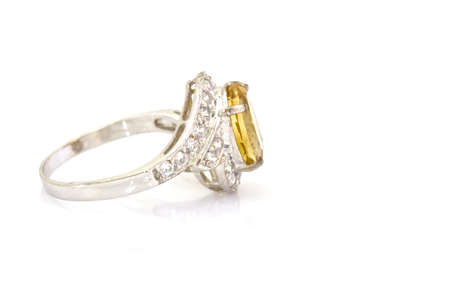 Yellow sapphire ring on whiteの写真素材