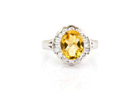 Yellow sapphire ring on whiteの写真素材