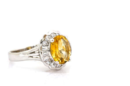 Yellow sapphire ring on whiteの写真素材