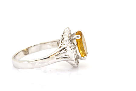Yellow sapphire ring on whiteの写真素材