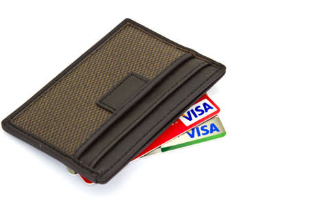 isolated Brown wallet with Credit cards bunchのeditorial素材