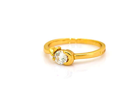 Wedding gold diamond ring isolated on whiteの写真素材