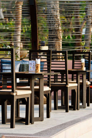 wooden tables and chairs in coffee shopのeditorial素材