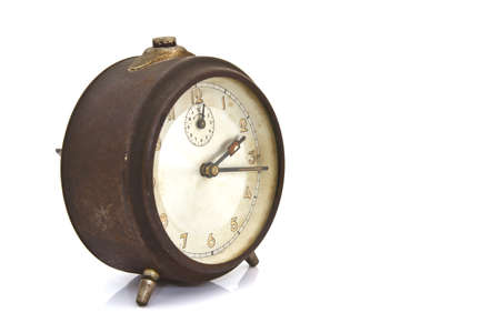 vintage alarm clock over white isolatedの写真素材