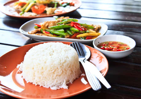 Fresh Thai food stir fry and white jasmine rice.の写真素材