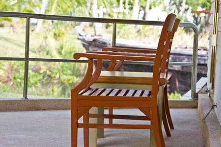 Relaxing under a palm tree on beachの写真素材