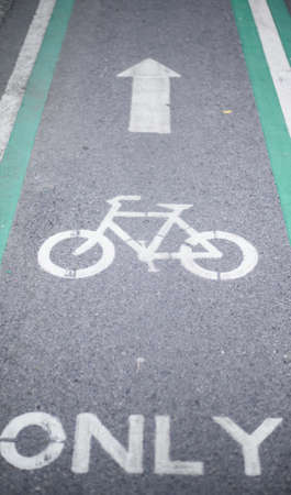 Bicycle road sign and arrow on bike lane road
