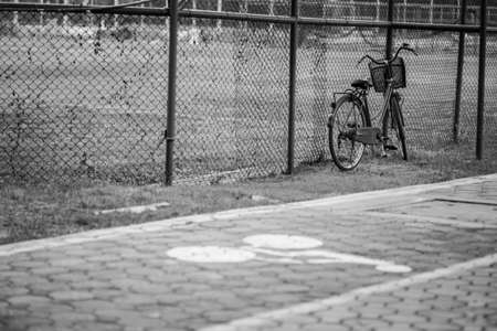 bicycles with bike sign on green yard field