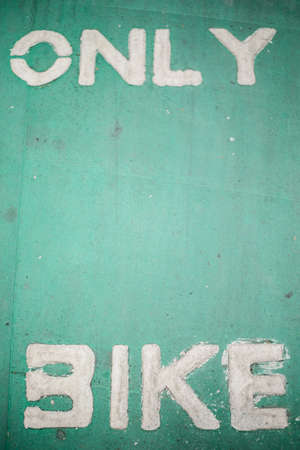 Bike symbol on the bike lane road backgroundの写真素材
