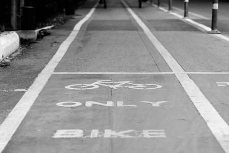 Bike symbol on the bike lane road backgroundの写真素材